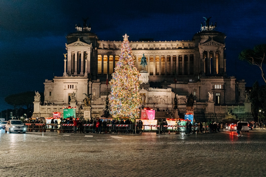 a large christmas tree in front of a building